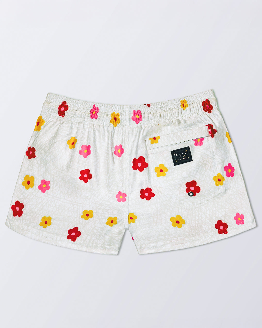 DC2 BUY MYSELF FLOWERS Poolside Shorts – back view with single pocket and colorful floral design.
