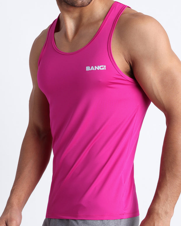 Side view of men’s workout tank top in bright ruby color made by BANG! Clothing the official brand of mens beachwear.