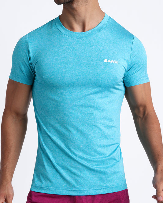 BANG Miami Olympic Blue Fitness T-Shirt — model wearing fitted performance tee in Olympic blue, lightweight stretch fabric with minimal chest logo.