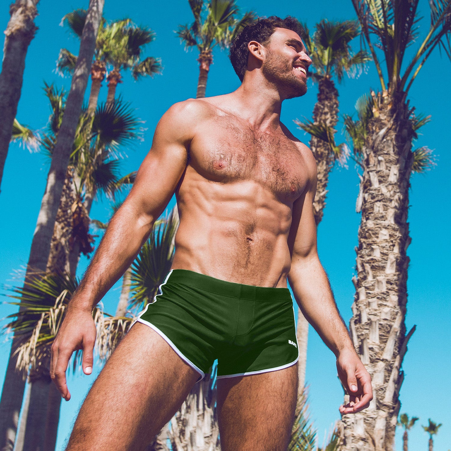 The Green Colors swimwear series by BANG! Miami, featuring the ALPHA GREEN Swim Shorts a forest green color for men by BANG! Clothes.