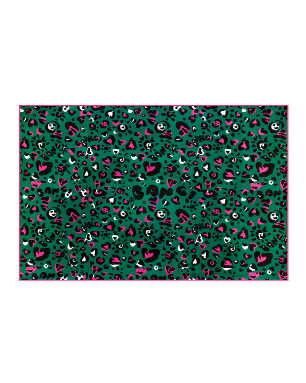 The CAMO CHAMELEON unisex lightweight towel in forest green color with bold black and bright pink camo print, with a prominent BANG! illustration.