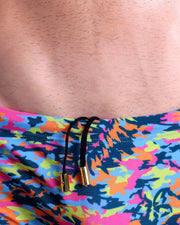 Close-up view of the CAMO POP (COLOR MIX) men’s drawstring briefs showing black cord with custom branded golden cord ends, and matching custom eyelet trims in gold.