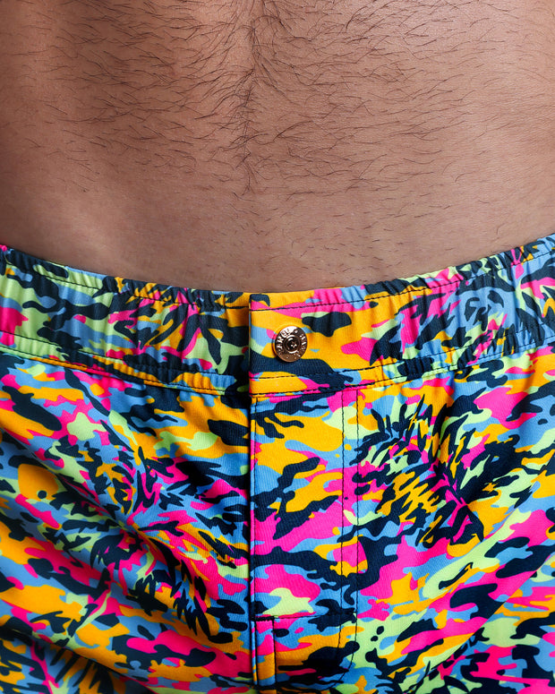 Close-up view of the CAMO POP (NEON MIX) men’s Mini shorts, showing custom branded metal button in gold by Bang!