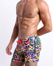 Side view of the CAMO POP (NEON MIX) Summer fLEX Shorts with dual zippered-pockets for men featuring a colorful neon camo print are designed by BANG! Clothes in Miami.