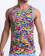 Male model wearing CAMO POP (NEON MIX) beach Tank Top, a multicolor neon print for men. This premium quality top is by BANG! Clothes, a men’s beachwear brand from Miami.