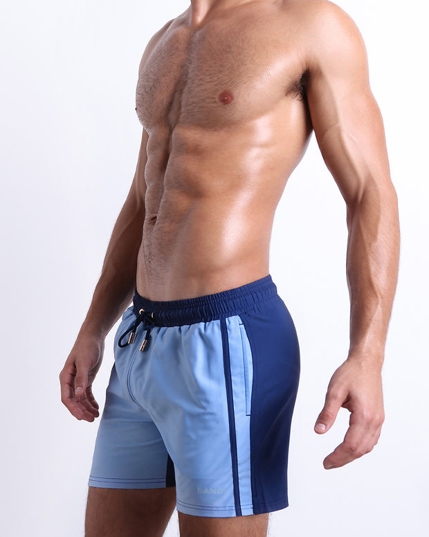 Side view of the CASINO ROYALE (BLUE) for men’s summer Resort Shorts with dual pockets. Inspired by actor Daniel Craig&