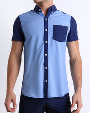Front view of the CASINO ROYALE (BLUE) men’s sleeveless stretch shirt in color-block blue colors. Inspired by actor Daniel Craig's iconic blue swim trunks worn in the 2006 film Casino Royale, this shirt was designed by BANG! Clothes in Miami.