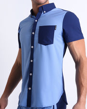 Side view of the CASINO ROYALE (BLUE) men’s Summer button-down in dual-tone split dark blue and light blue color. Inspired by actor Daniel Craig's iconic blue swim trunks worn in the 2006 film Casino Royale, is designed by BANG! Clothes in Miami.