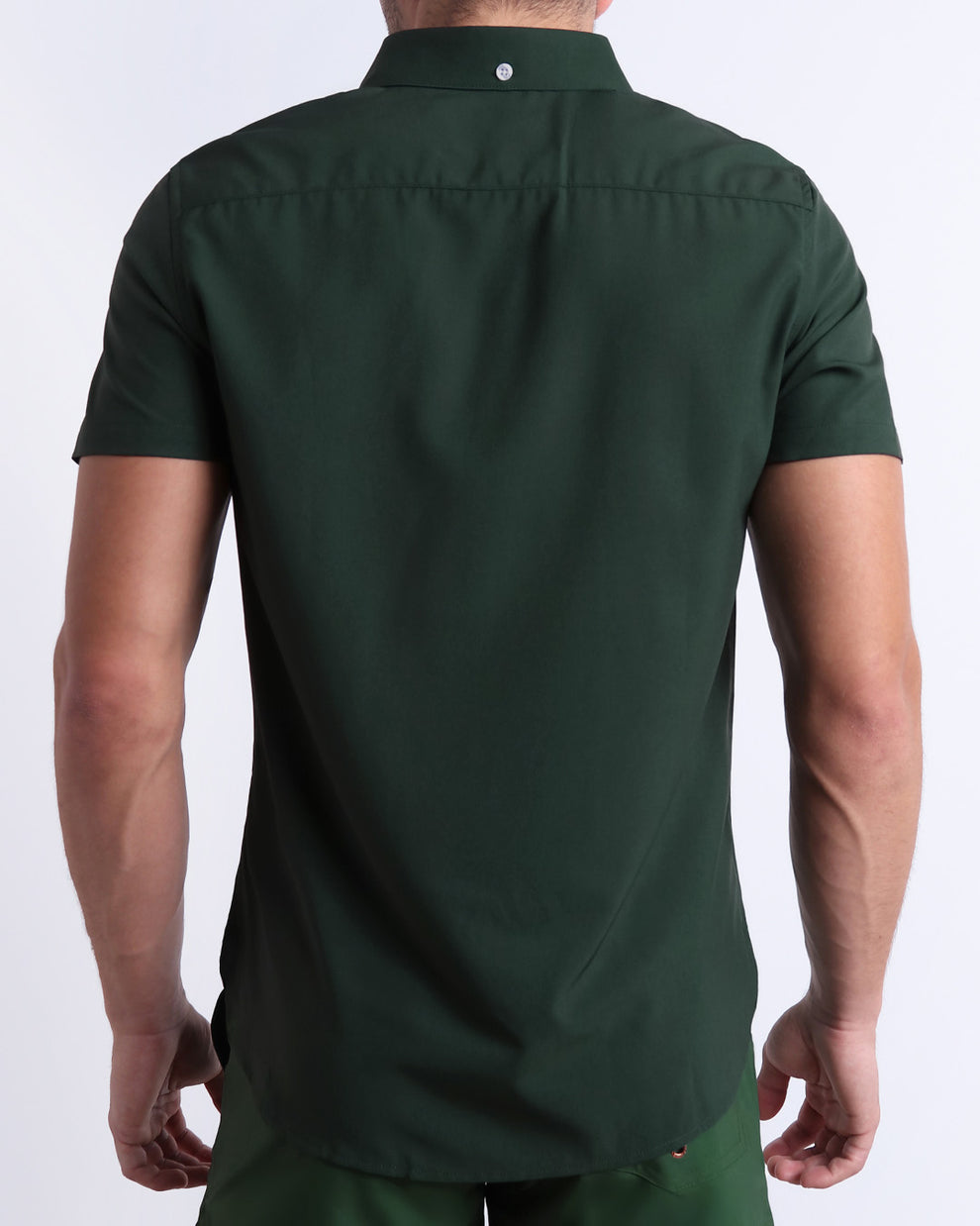 The back side of the CASINO ROYALE (GREEN) stretch shirt for men with a stylish color block design in dark green and light green for men. This high-quality button-up shirt is by BANG! Clothes, a men’s beachwear brand from Miami. Inspired by the iconic style of Daniel Craig's blue swim trunks in the 2006 film Casino Royale.