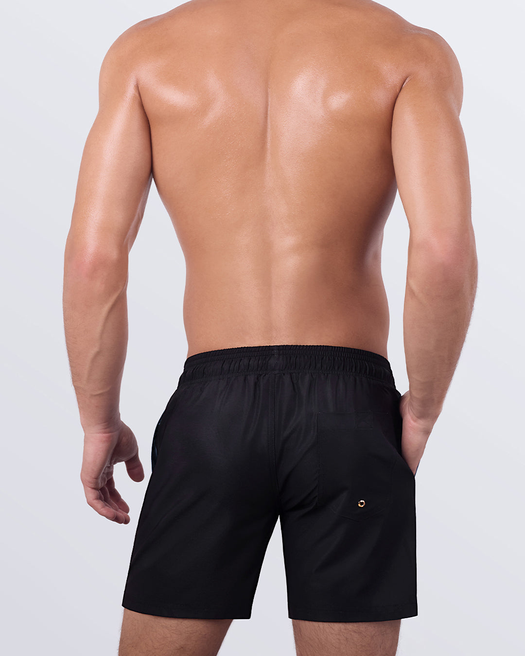 A back view of the CASINO ROYALE (GREY) - Resort Shorts, highlighting the black back panel, secure pocket, and gold-tone hardware details.