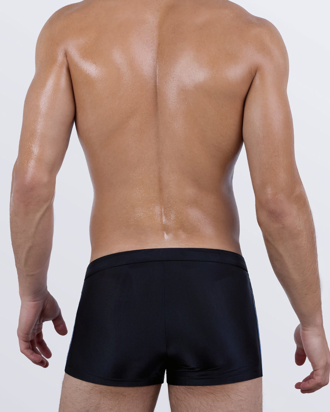 Back view of the CASINO ROYALE Swim Trunks – solid black rear for a clean, minimal aesthetic and tailored fit.