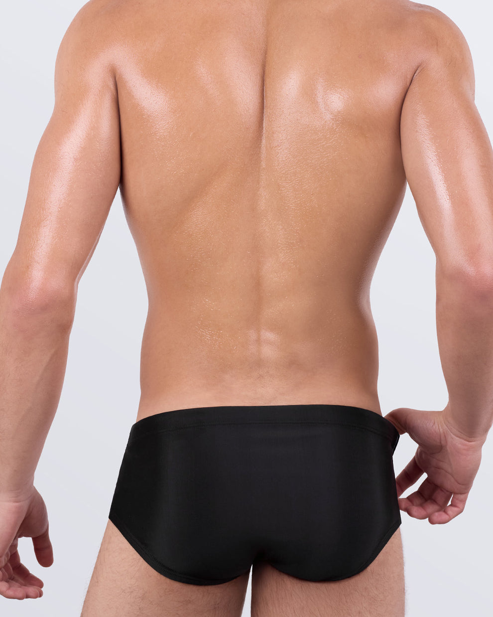 Back view of Casino Royale Swim Sunga by BANG! – solid black back panel in a body-contouring Brazilian cut designed for comfort and support.