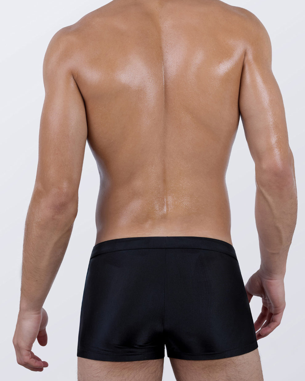 Back view of the CASINO ROYALE Swim Trunks – minimalist black back panel for balance and contouring contrast.