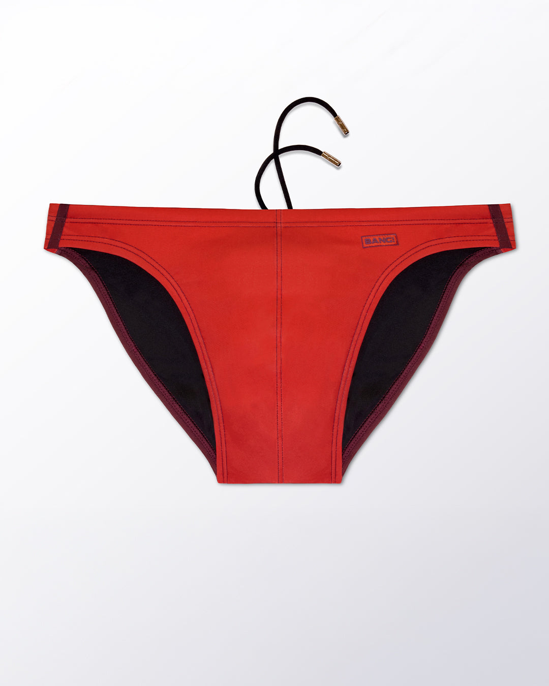 Flat lay of the BANG Miami Casino Royale (Red) Swim Mini Brief, featuring a bold red tone with contrasting black panels in a sleek, sculpted mini brief silhouette.