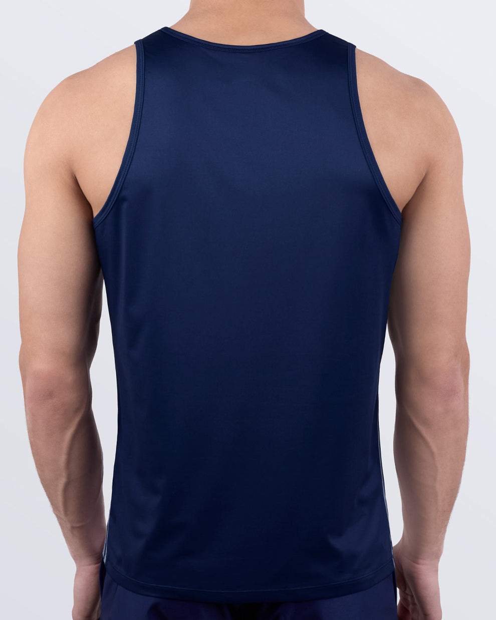 Back view of the men's tank top in CASINO ROYALE (WHITE + NAVY BLUE) by BANG! Miami. Solid navy blue back in breathable, moisture-wicking fabric made for performance and comfort.