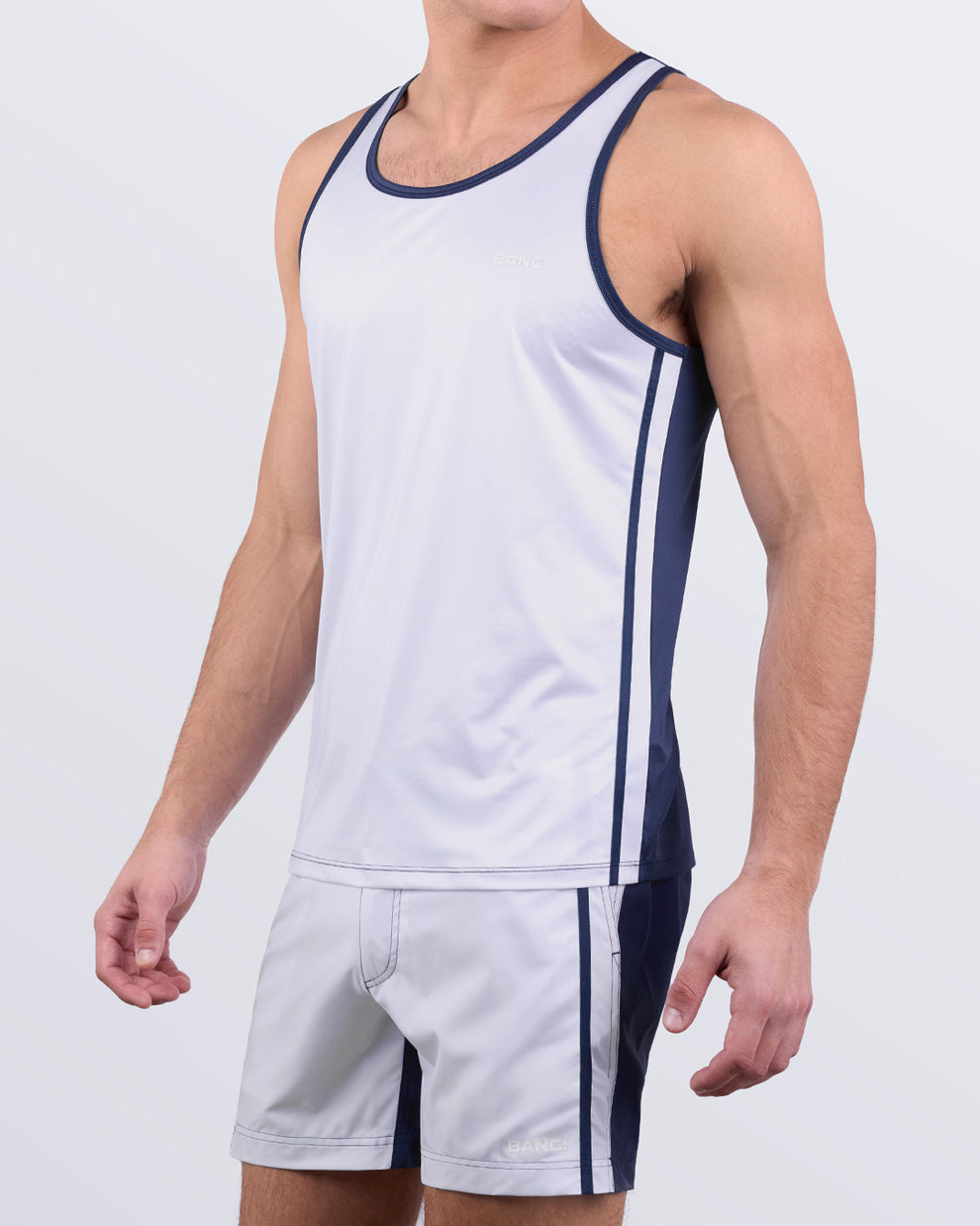 Men's matching gym and swim set in CASINO ROYALE (WHITE + NAVY BLUE) by BANG! Miami – athletic tank top paired with swim shorts for a stylish fitness and beach-ready look.