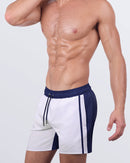 Close-up of the CASINO ROYALE (WHITE + NAVY BLUE) - Resort Shorts, highlighting the sleek design, deep side pockets, and premium 4-way stretch fabric for all-day comfort.