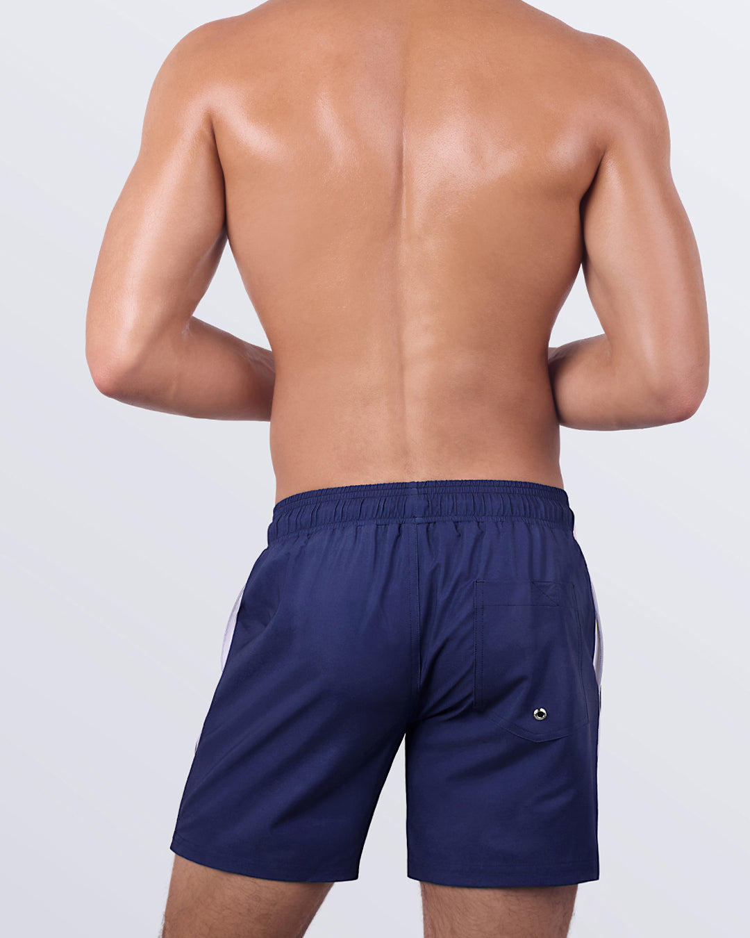 Back view of the CASINO ROYALE (WHITE + NAVY BLUE) - Resort Shorts, showcasing the elasticated waistband, back pocket with a button closure, and a tailored yet relaxed silhouette.