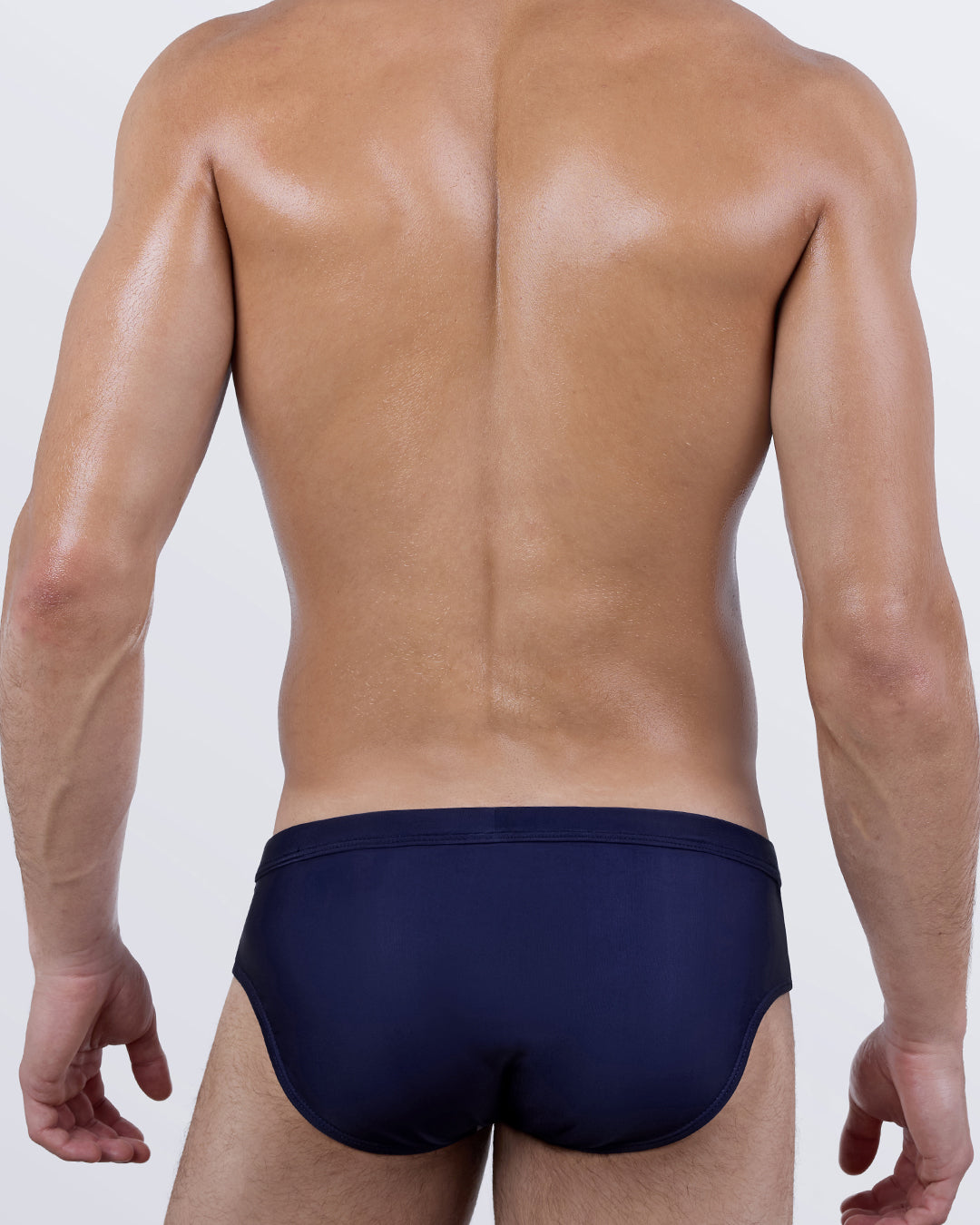 Back view of the Casino Royale (White + Navy Blue) Swim Brief showcasing the solid navy rear panel and streamlined, comfortable coverage.