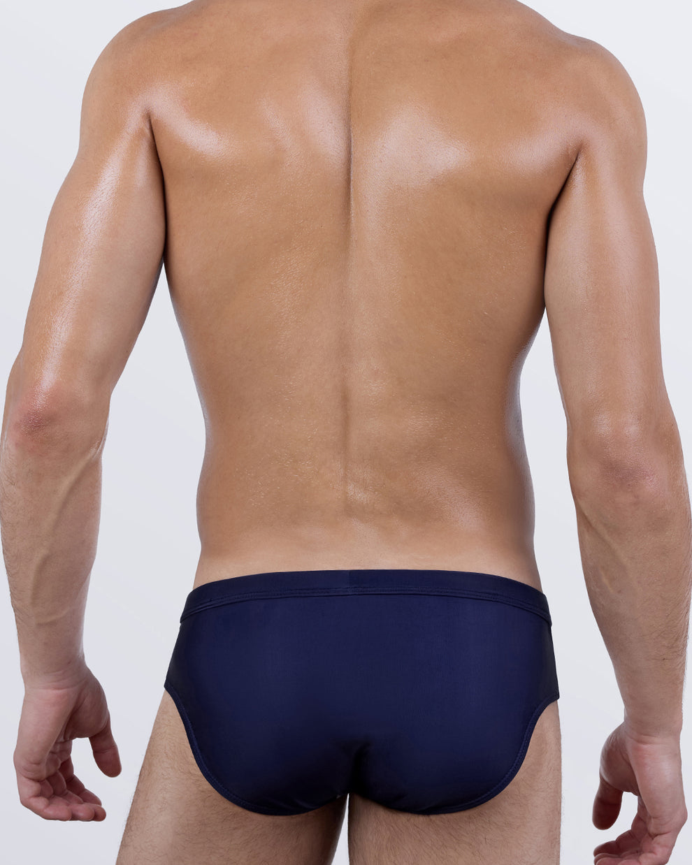 Back view of the Casino Royale (White + Navy Blue) Swim Brief showcasing the solid navy rear panel and streamlined, comfortable coverage.