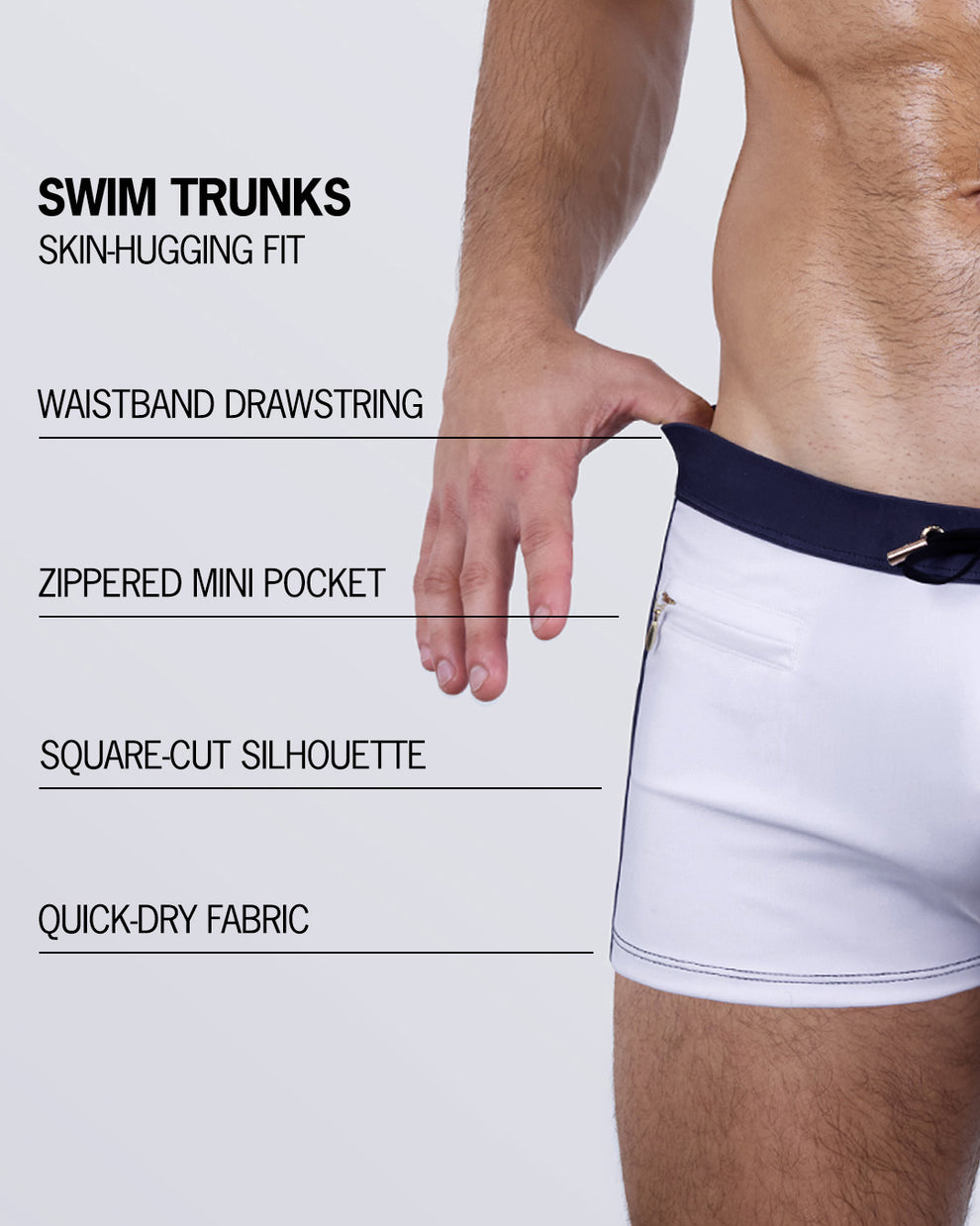 Breakdown of the CASINO ROYALE (WHITE + NAVY BLUE) Swim Trunks – tailored fit with square-cut legs, drawstring waistband, zippered mini pocket, and quick-dry stretch fabric.