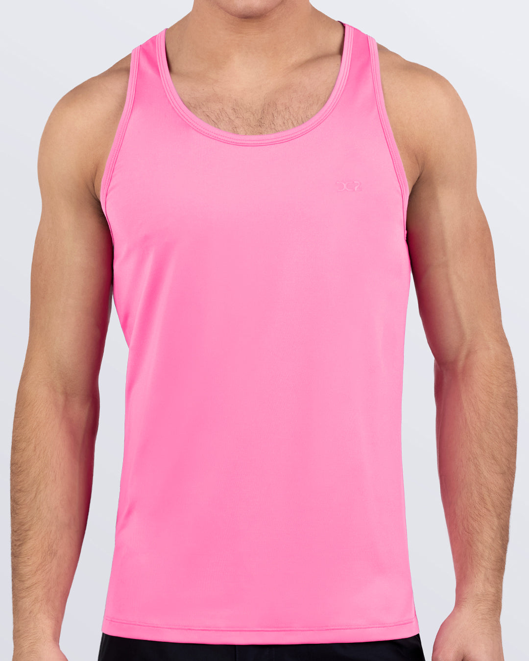 DC2 CHARMED PINK Gym Tank Top — model wearing pink scoop-neck athletic tank, ideal for training and gym workouts.