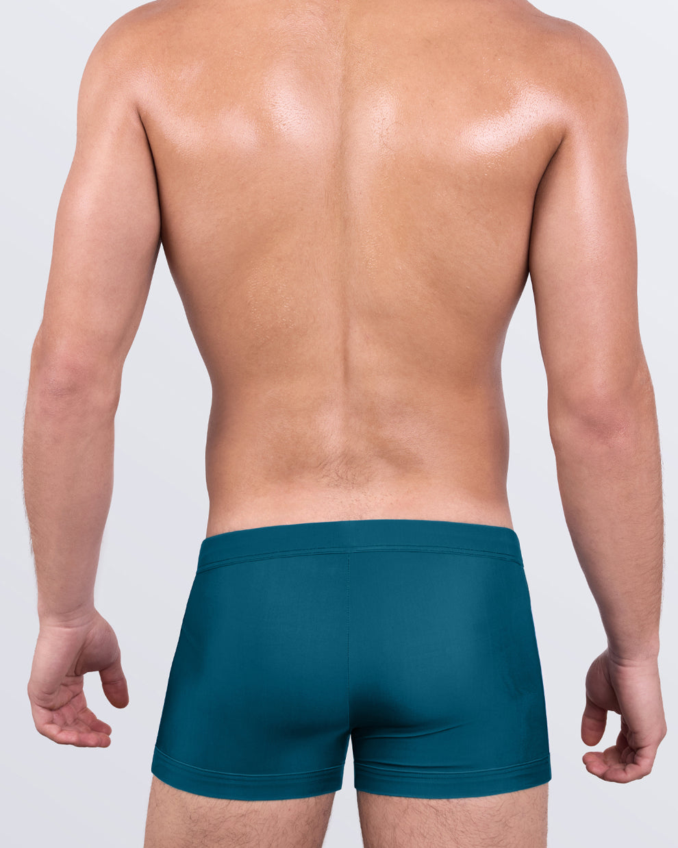 DC2 Chic Teal Swim Trunks — back view showing smooth tailored finish and sculpted rear panel.