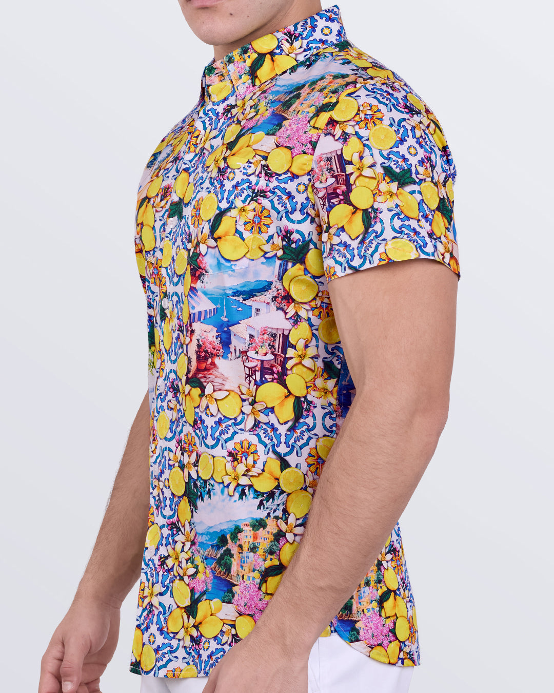 Men’s slim-fit cotton shirt in vibrant lemon, floral, and tile print with tapered profile and short sleeves.