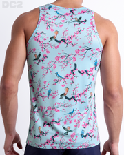 Male model wearing men’s CLOSE TO YOU men’s Summer Tank Top in a light blue color with an exotic birds print. This high-quality shirt is by DC2, a men’s beachwear brand from Miami.