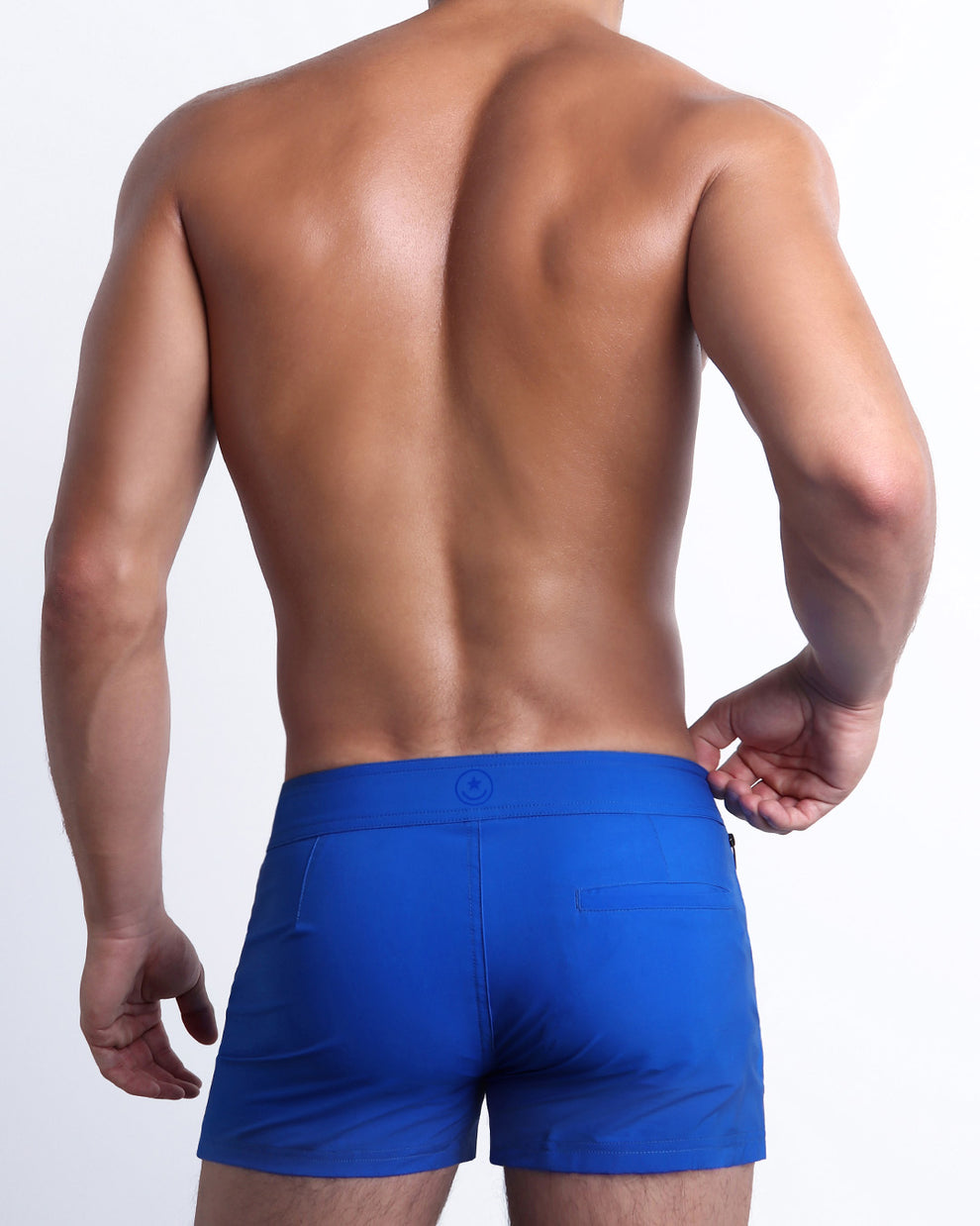 Back view of the CLUB BLUE beach trunks for men by BANG! menswear Miami in bright blue color.