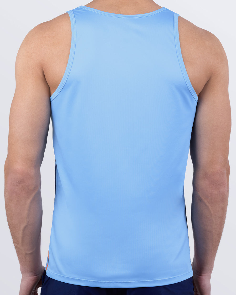 Male model wearing men’s COASTAL BLUE men’s Summer Tank Top in sky blue color with stylish navy and orange colored stripes. This high-quality shirt is by DC2, a men’s beachwear brand from Miami.