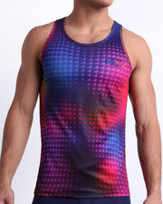 Male model wearing CONFESSION ON A SAND FLR VOL 2 beach tank top, premium quality silky top in red, purple, blue, and pink disco ball print for men. This high-quality Summer top by BANG! Clothes, a men’s beachwear brand from Miami.