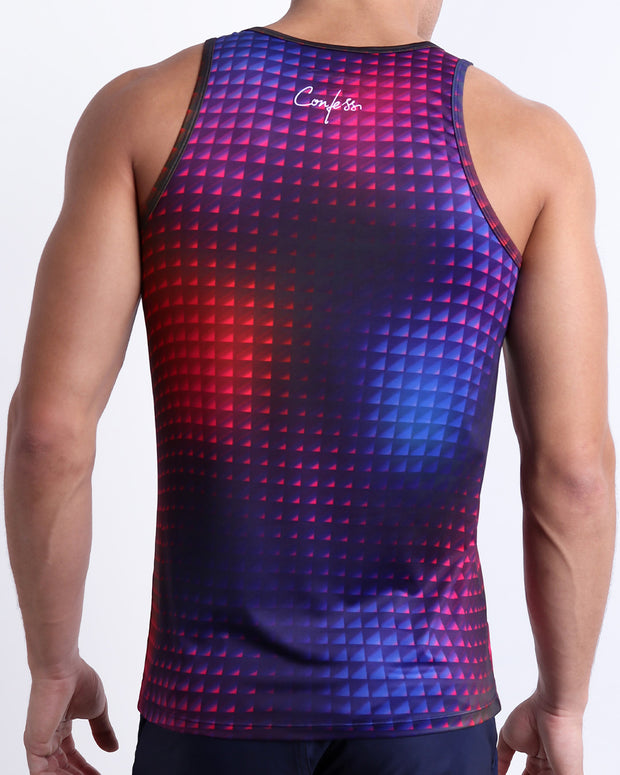 Back view of a male model wearing men’s CONFESSIONS ON A SAND FLR VOL 2 beach casual Tank Top in a pop color with disco ball print with the phrase "Confess" made by BANG! Clothes in Miami.
