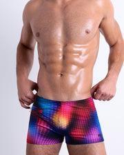 Front view of the CONFESSIONS ON A SAND FLR VOL 2 men’s Swim Trunks in multiple colors disco ball print. This premium quality swimwear is by BANG! Clothes, a men’s beachwear brand from Miami.