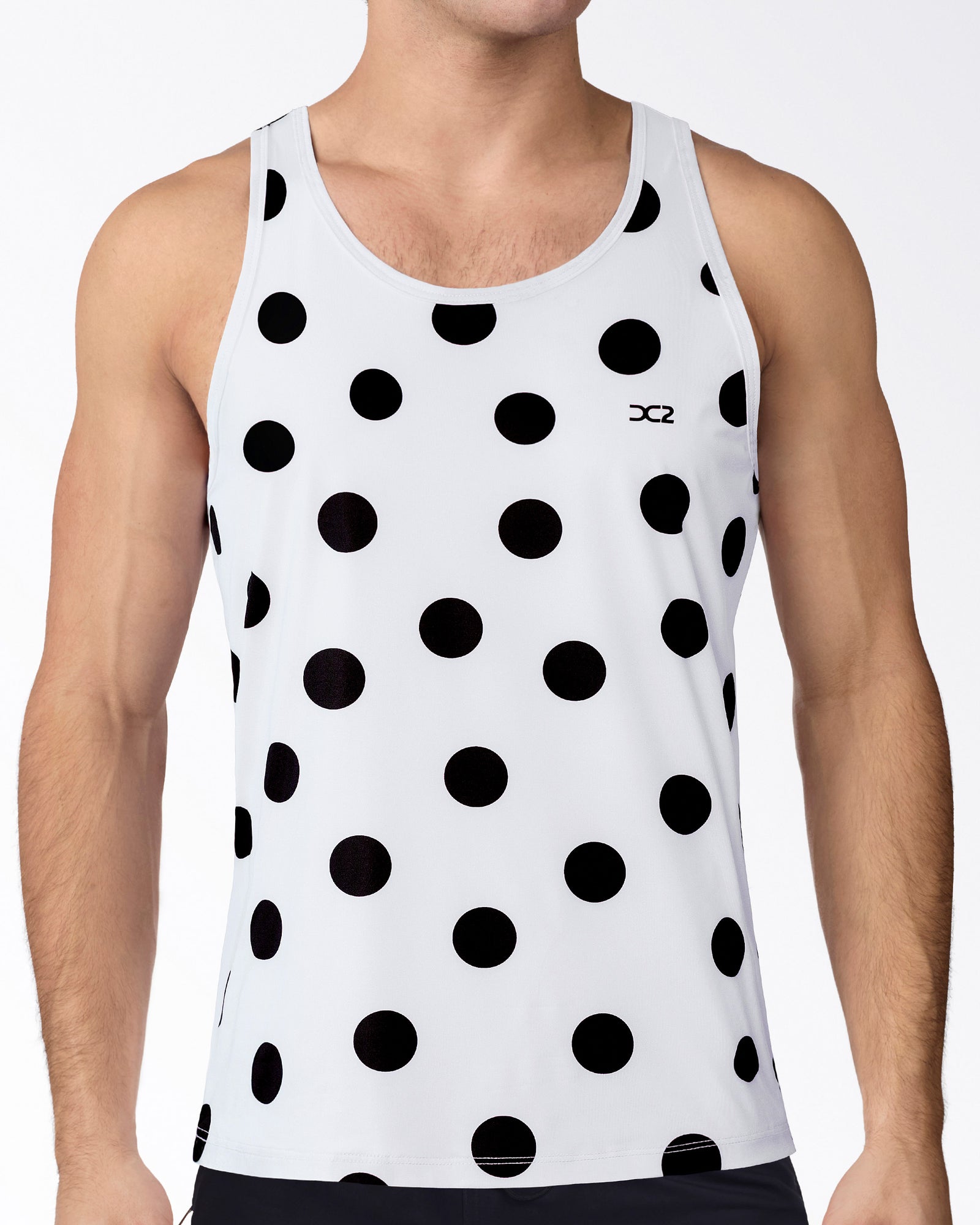 Connect The Dots Tank Top by DC2 Miami featuring oversized black polka dots on white performance fabric with a lightweight athletic fit.