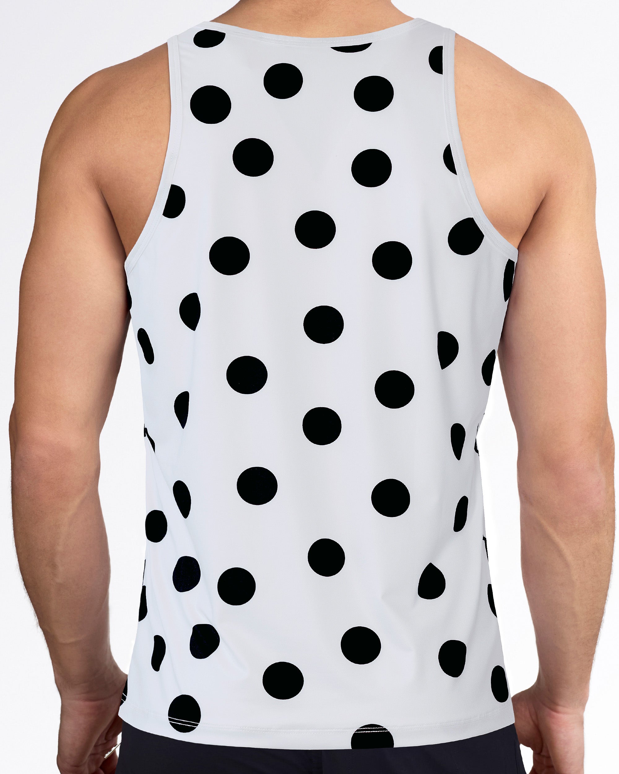 Men’s workout tank top with racerback-style cut, allover black dot print, white performance fabric, and sleeveless fit.