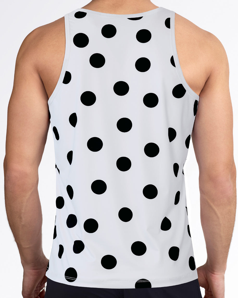 Men’s workout tank top with racerback-style cut, allover black dot print, white performance fabric, and sleeveless fit.