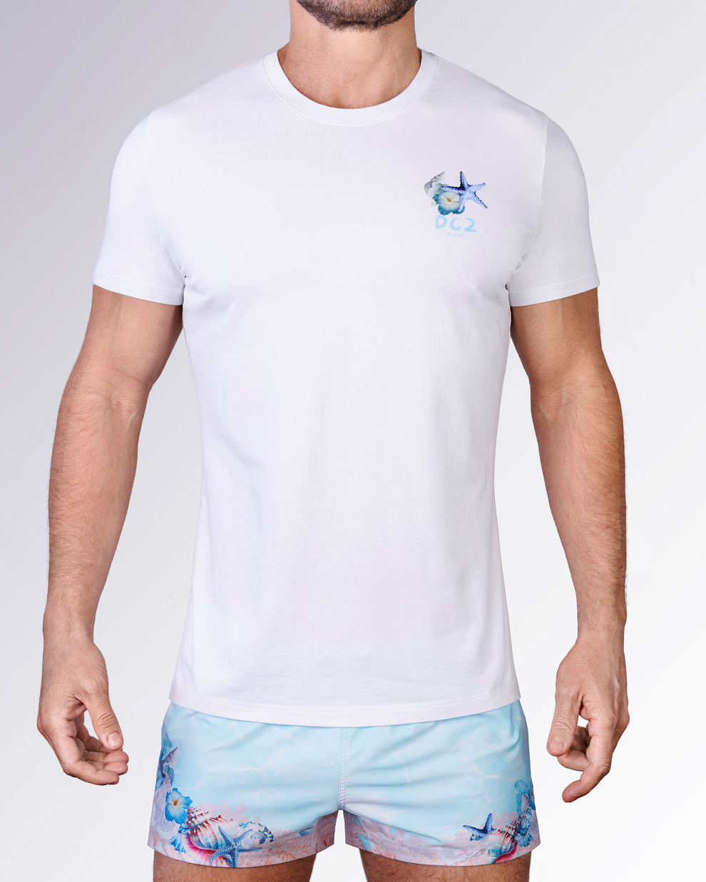 Full front view of the Coral Way Cotton Graphic T-Shirt by DC2 Miami, paired with matching pastel blue Coral Way Poolside Shorts.