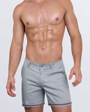 DC2 Deep Grey Street Shorts — model wearing structured chino shorts with sleek navy and red striped cuffs.