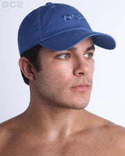 Side view of the Chillax Cap in DENIM BLUE,  a dark blue color, features ventilation eyelets on the cap to provide extra breathability, perfect for active wear.