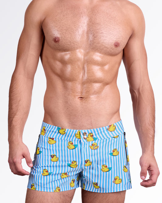 BANG Ducks Just Wanna Have Fun Beach Shorts — close front view highlighting the fun duck print, structured waistband with double snap-button closure, and modern resort-ready design.