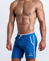 Side view of men’s calisthenics exercise shorts for men in a royal blue color made by BANG! Clothing the official brand of mens sportswear.