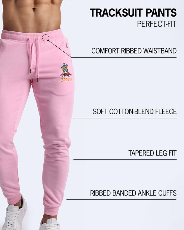 An infographic showcasing BANG! Clothes’ Tracksuit Pants features: a ribbed waistband, cotton-blend fleece, tapered leg fit, and ribbed ankle cuffs for a comfortable and perfect fit.