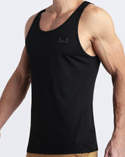 Side view of men’s workout tank top in EXACT BLACK a deep black color with a metallic plaque logo made by DC2 Clothing the new official brand of mens beachwear. 