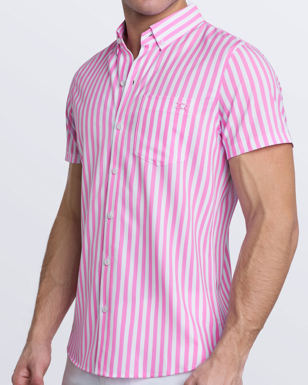 Angled front view of Chill Pink stretch shirt featuring vertical stripes, button-down collar, and modern resort vibe.