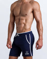 Side view of men’s calisthenics exercise shorts for men in a dark blue color made by BANG! Clothing the official brand of mens sportswear.