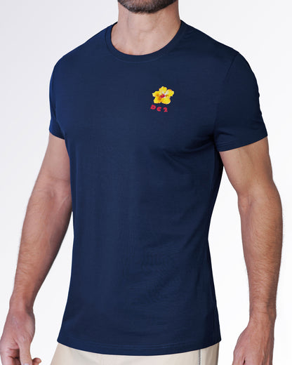 Angled view of the Flower Powers (Blue) Graphic T-Shirt featuring a navy crewneck silhouette with vibrant floral chest artwork and a modern tailored fit.