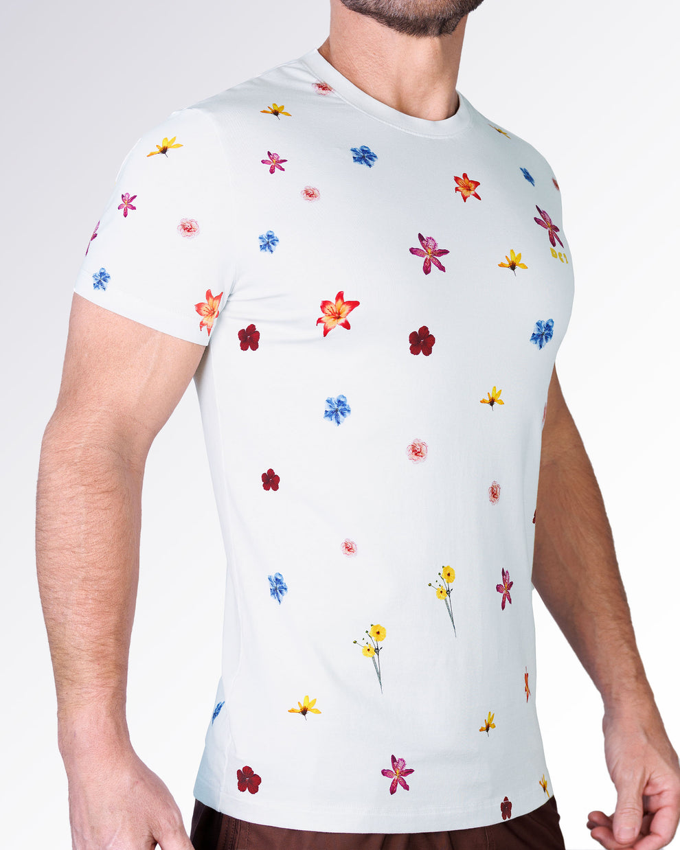 Flower Powers Cream Graphic T-Shirt by DC2 Miami shown from the side, highlighting the all-over floral print with colorful blooms on a cream background.