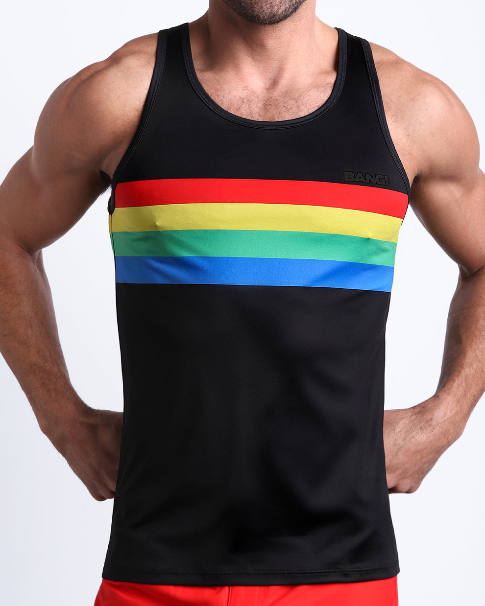 Frontal view of Male model wearing the FOUREVER STRIPES VOL 1 men's beach tank top by the Bang! Clothes brand of men's swimwear from Miami.