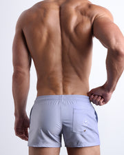 Back view of the GRAY ANATOMY beach trunks for men by BANG! menswear Miami in light smoke grey color.